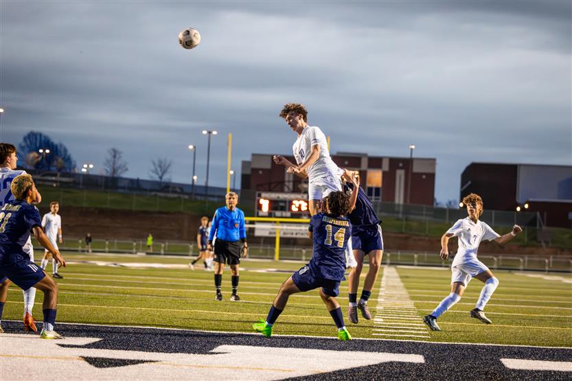 Students play soccer